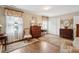 Bright bedroom with hardwood floors, floral window treatments, and classic furniture for a cozy retreat at 21 Rutledge Ave, Charleston, SC 29401