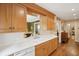 Well-lit kitchen area featuring wooden cabinetry and a functional layout at 21 Rutledge Ave, Charleston, SC 29401