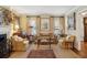 Bright living room with a fireplace, comfortable seating, and natural light at 21 Rutledge Ave, Charleston, SC 29401