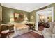 Serene living room with a traditional sofa, elegant area rug, and doorway views into a dining space at 21 Rutledge Ave, Charleston, SC 29401