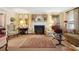 Cozy living room with a fireplace, decorative rug, and classic furnishings at 21 Rutledge Ave, Charleston, SC 29401