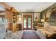 Inviting living room with french doors, green wall coverings, a patterned sofa, and classic decor for comfortable living at 21 Rutledge Ave, Charleston, SC 29401