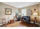 Bright office space with wooden floors, a dark writing desk, and classic decor for work or study at 21 Rutledge Ave, Charleston, SC 29401