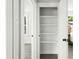 View into an organized closet, with shelving, and natural light from a window in the adjacent bedroom at 2122 Commander Rd, North Charleston, SC 29405