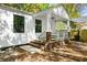 Inviting front porch with brick accents, fresh white paint, and classic architectural details at 2122 Commander Rd, North Charleston, SC 29405