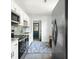 Modern kitchen with stainless steel appliances, white cabinets, and stylish backsplash at 2122 Commander Rd, North Charleston, SC 29405