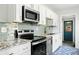 Well-appointed kitchen featuring granite countertops, stainless appliances, and ample cabinet space at 2122 Commander Rd, North Charleston, SC 29405