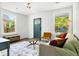 Open living room space with a cozy sofa and natural light, perfect for entertaining or relaxing at 2122 Commander Rd, North Charleston, SC 29405