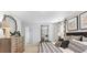 Bedroom featuring stylish furnishings, a mirror, decorative pillows, and plenty of natural light at 2324 Macallan Blvd, Ravenel, SC 29470