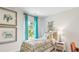 Bright bedroom with an elephant themed decor, natural light, and bedside table at 2324 Macallan Blvd, Ravenel, SC 29470