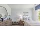 Inviting bedroom featuring a dresser, accents, decor and lots of light from the large window at 2324 Macallan Blvd, Ravenel, SC 29470