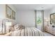 Cozy bedroom with neutral decor, large windows, and comfortable bedding provides a relaxing retreat at 2324 Macallan Blvd, Ravenel, SC 29470