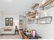 Versatile bonus room with shelving, desk, and seating allows for a flexible and functional space at 2324 Macallan Blvd, Ravenel, SC 29470