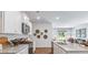 Bright kitchen with stainless appliances, granite countertops, and modern decor open to dining and living area at 2324 Macallan Blvd, Ravenel, SC 29470