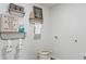 Bright laundry room with stylish shelving and decor, offering both functionality and a touch of modern design at 2324 Macallan Blvd, Ravenel, SC 29470