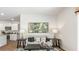 Bright living room adjacent to the kitchen features modern decor, stylish lamps, and plenty of space for entertaining at 2324 Macallan Blvd, Ravenel, SC 29470