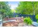 Landscaped backyard with stepping stones, mulch beds, decorative plants, and a privacy fence at 2338 Kings Gate Ln, Mount Pleasant, SC 29466