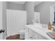 Well-lit bathroom with a white vanity, toilet, and shower featuring neutral walls and flooring at 2338 Kings Gate Ln, Mount Pleasant, SC 29466