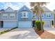 Townhome featuring a spacious driveway, single-car garage, and low maintenance front yard at 2338 Kings Gate Ln, Mount Pleasant, SC 29466
