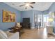 Living room featuring neutral sofa, decorative artwork, stylish furnishings, and ceiling fan at 2338 Kings Gate Ln, Mount Pleasant, SC 29466