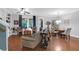 Open-concept living room with built-in shelving, ceiling fan, and access to the outdoor space at 2338 Kings Gate Ln, Mount Pleasant, SC 29466