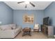 Living room featuring neutral sofa, decorative artwork, stylish furnishings, and ceiling fan at 2338 Kings Gate Ln, Mount Pleasant, SC 29466