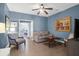 Living room featuring neutral sofa, decorative artwork, stylish furnishings, and ceiling fan at 2338 Kings Gate Ln, Mount Pleasant, SC 29466