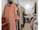 Organized walk-in closet filled with clothing and accessories, maximizing storage and space at 2338 Kings Gate Ln, Mount Pleasant, SC 29466