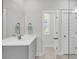 Bathroom with modern vanity with undermount sink, framed mirror, and tile flooring at 2568 Hatch Dr, Johns Island, SC 29455