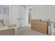 Cozy Bedroom with a changing table, neutral decor, and ample closet space at 2568 Hatch Dr, Johns Island, SC 29455