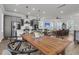 Inviting dining area showcasing an elegant wood table and seamless flow to the kitchen at 2568 Hatch Dr, Johns Island, SC 29455
