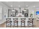 Modern kitchen boasts an island with seating, stainless steel appliances, and stylish pendant lighting at 2568 Hatch Dr, Johns Island, SC 29455
