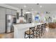 Sleek kitchen island featuring pendant lights, bar stools, and stainless steel appliances at 2568 Hatch Dr, Johns Island, SC 29455