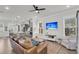 Bright living room featuring wood floors, ceiling fan, and an open floor plan at 2568 Hatch Dr, Johns Island, SC 29455