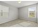 Bedroom with carpet flooring, neutral walls, and two windows at 258 Godwit Dr, Summerville, SC 29486