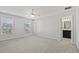 Spacious bedroom with two large windows, carpeted flooring, and ceiling fan with light fixture at 258 Godwit Dr, Summerville, SC 29486