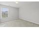 Bedroom featuring neutral carpet, walls and one window with neighborhood views at 258 Godwit Dr, Summerville, SC 29486