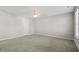 Empty bedroom featuring neutral paint, carpet, a ceiling fan, and a large window at 258 Godwit Dr, Summerville, SC 29486