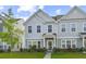 Well-manicured lawn and landscaping lead up to this charming two-story townhome at 258 Godwit Dr, Summerville, SC 29486