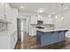 Modern kitchen with white cabinets, stainless steel appliances and a blue island at 258 Godwit Dr, Summerville, SC 29486
