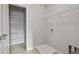 Laundry room with storage racks, utility sink hookup, and tiled floor at 258 Godwit Dr, Summerville, SC 29486