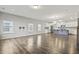 Spacious living room with wood floors, modern lighting, and an open concept design at 258 Godwit Dr, Summerville, SC 29486