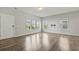 Bright living room with hardwood floors and large windows overlooking the neighborhood at 258 Godwit Dr, Summerville, SC 29486