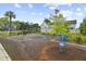 Community playground with various play structures and lush landscaping at 258 Godwit Dr, Summerville, SC 29486