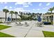 Resort-style pool area with seating, umbrellas, and lush landscaping perfect for relaxation and entertainment at 258 Godwit Dr, Summerville, SC 29486