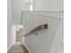 Carpeted staircase with wooden handrail and white walls, leading to the upper level at 258 Godwit Dr, Summerville, SC 29486