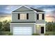 Charming two-story home featuring a grey exterior, complemented by a two-car garage and a welcoming front entrance at 279 Watersglen Dr, Summerville, SC 29486