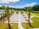 Aerial view of recreation area with sand volleyball, fire pit, picnic tables, palm trees and wooded area at 285 Watersglen Dr, Summerville, SC 29486
