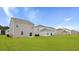 Expansive backyard view with multiple homes, showcasing the outdoor living space and neighborhood setting at 287 Watersglen Dr, Summerville, SC 29486