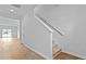 The hallway has hardwood floors and a staircase at 287 Watersglen Dr, Summerville, SC 29486